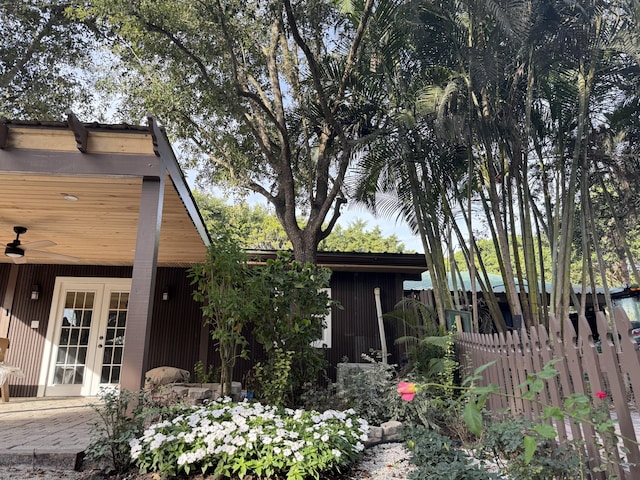 view of front of home with french doors and ceiling fan