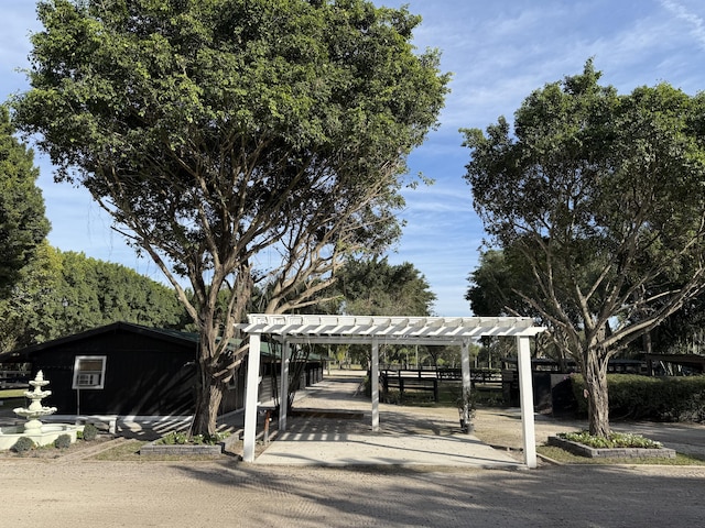 view of home's community with a pergola