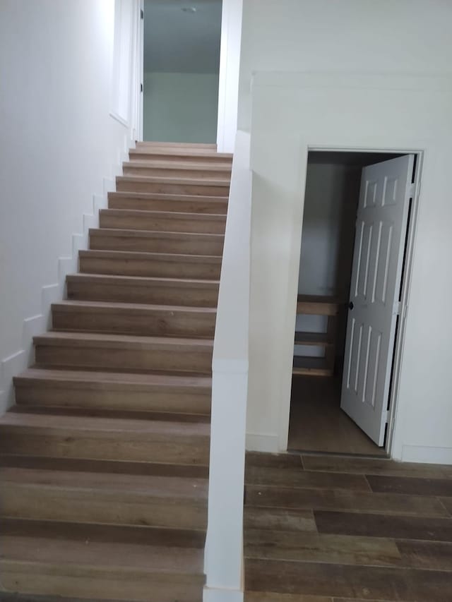 stairs with wood finished floors