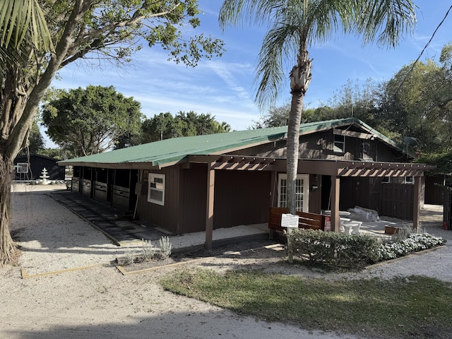 exterior space featuring metal roof