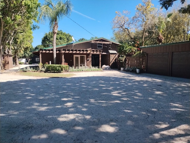 view of front of property featuring an outbuilding