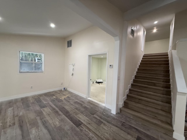 interior space featuring recessed lighting, visible vents, baseboards, and wood finished floors