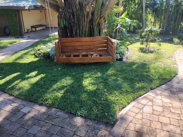 view of yard with a carport and driveway