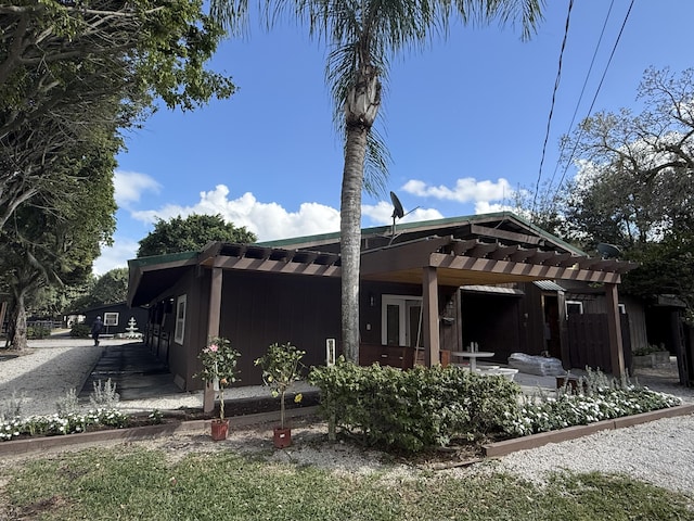 exterior space with a patio area and a pergola