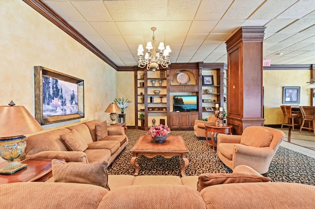 living room with tile patterned flooring, ornate columns, crown molding, and an inviting chandelier