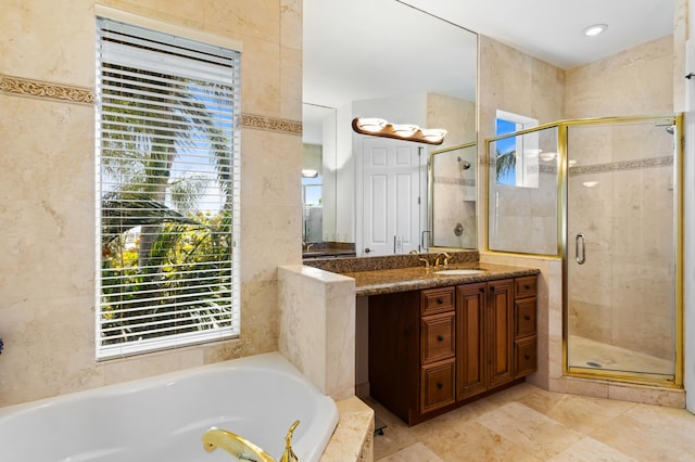 bathroom with vanity and plus walk in shower