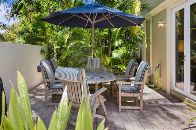 wooden terrace featuring a patio