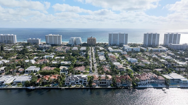 drone / aerial view featuring a water view and a view of city