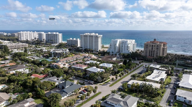 drone / aerial view featuring a water view and a city view