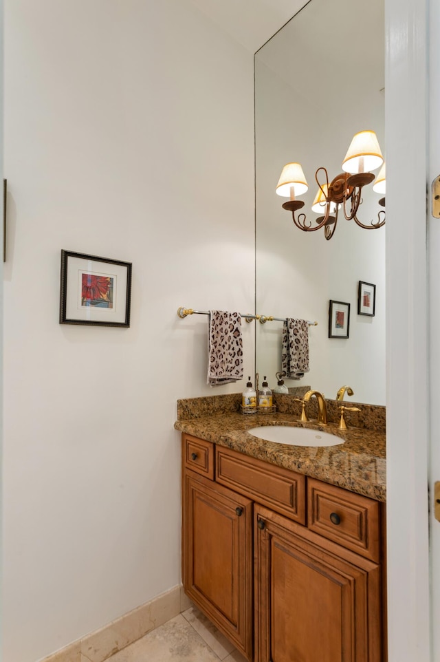 bathroom featuring tile patterned flooring and vanity