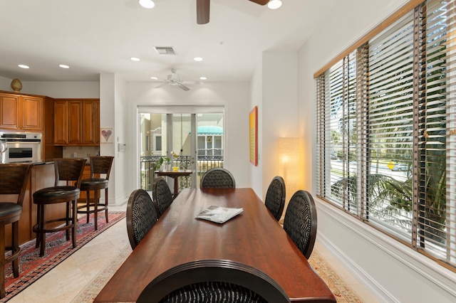 interior space with ceiling fan and a wealth of natural light