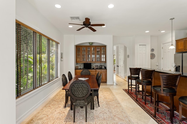 dining area with ceiling fan