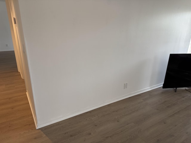 unfurnished room featuring dark hardwood / wood-style floors