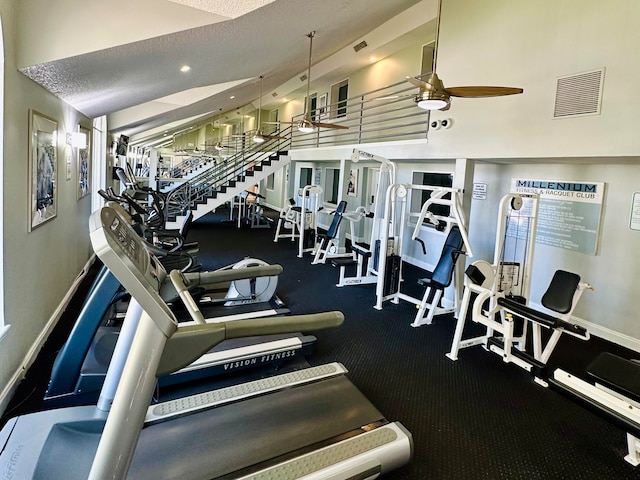 workout area with a textured ceiling and ceiling fan