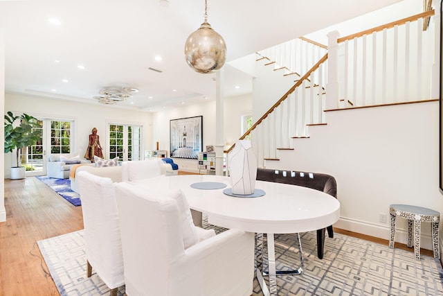 dining space with light hardwood / wood-style floors