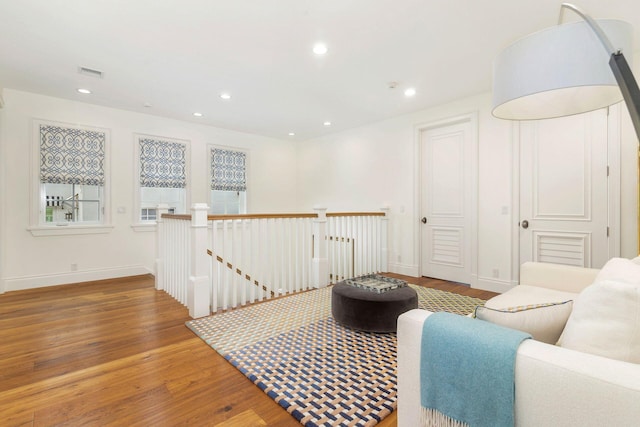 living area with hardwood / wood-style flooring