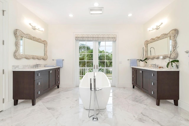 bathroom with vanity and a bathing tub