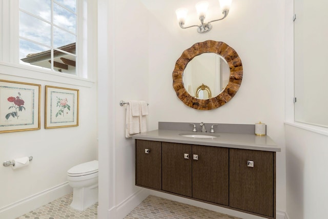 bathroom featuring vanity, toilet, and tile patterned floors