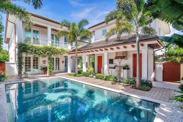 view of pool featuring a patio and french doors