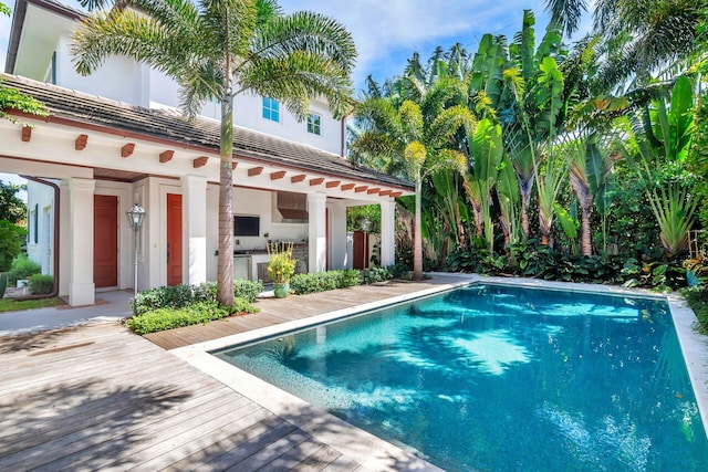 view of pool with a wooden deck