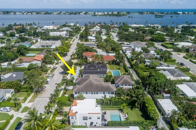 birds eye view of property featuring a water view