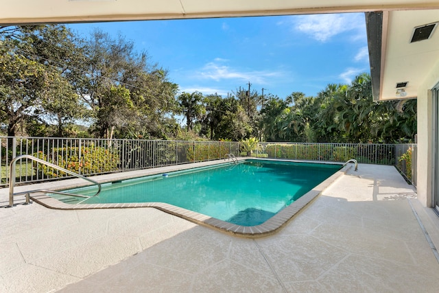 view of swimming pool with a patio