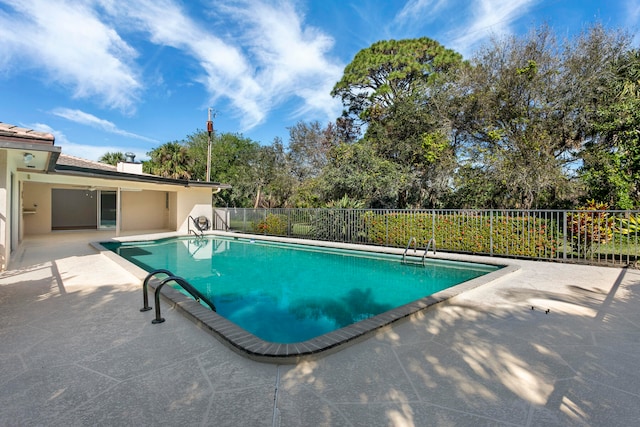 view of swimming pool with a patio area