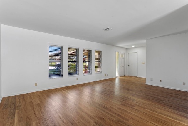 spare room featuring hardwood / wood-style flooring