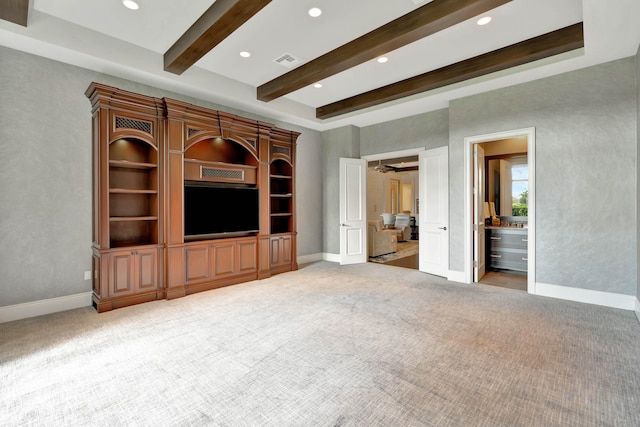 unfurnished living room featuring carpet and beam ceiling