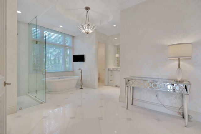 bathroom featuring independent shower and bath, an inviting chandelier, crown molding, and vanity