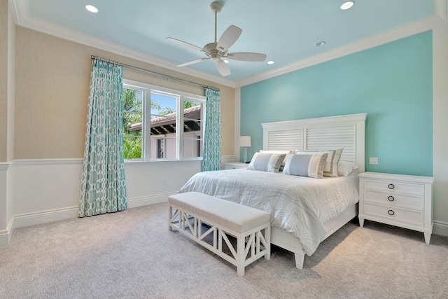 bedroom with carpet, ceiling fan, and ornamental molding