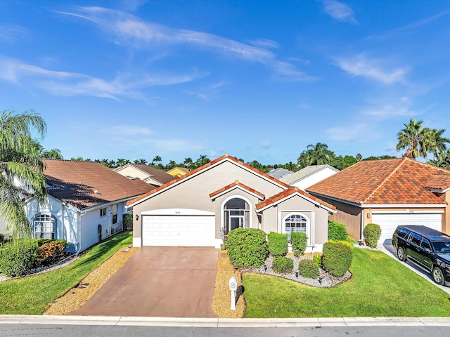 view of front of home with a garage and a front yard