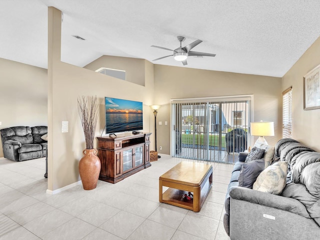 tiled living room with ceiling fan, a textured ceiling, and lofted ceiling