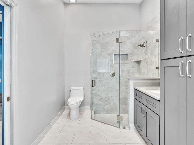 bathroom featuring tile patterned flooring, walk in shower, vanity, and toilet