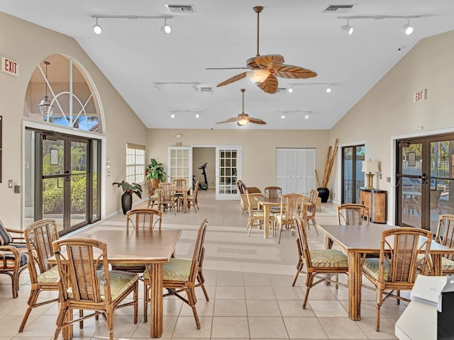 dining room featuring light tile patterned floors, ceiling fan, track lighting, and french doors