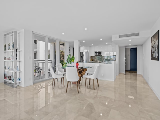 dining room featuring floor to ceiling windows