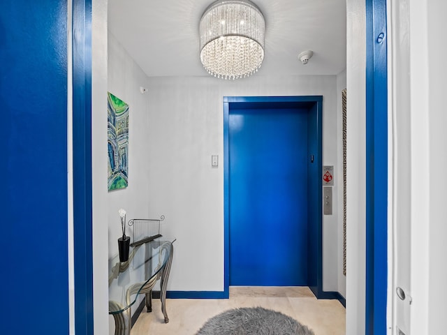 foyer entrance with an inviting chandelier