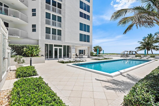 view of pool featuring a patio area