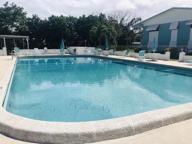 view of swimming pool featuring a patio