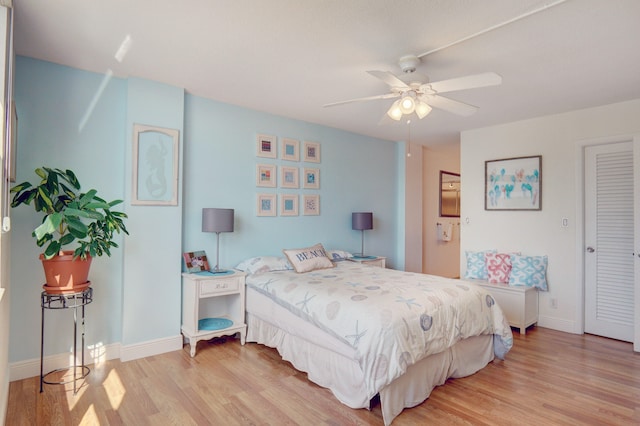 bedroom featuring ceiling fan and light hardwood / wood-style flooring