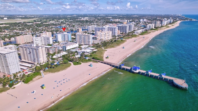 bird's eye view featuring a view of the beach and a water view