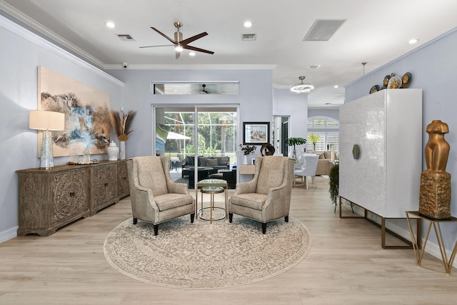 sitting room with a wealth of natural light, light hardwood / wood-style flooring, and ceiling fan