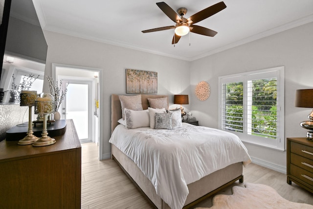 bedroom featuring light wood-type flooring, ceiling fan, and crown molding