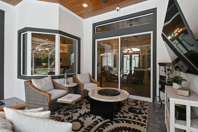 exterior space with wood ceiling, a chandelier, crown molding, and vaulted ceiling