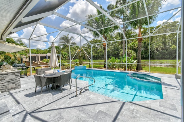 view of pool featuring glass enclosure and a patio