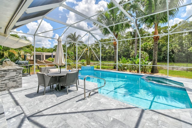 view of swimming pool with a lanai and a patio area