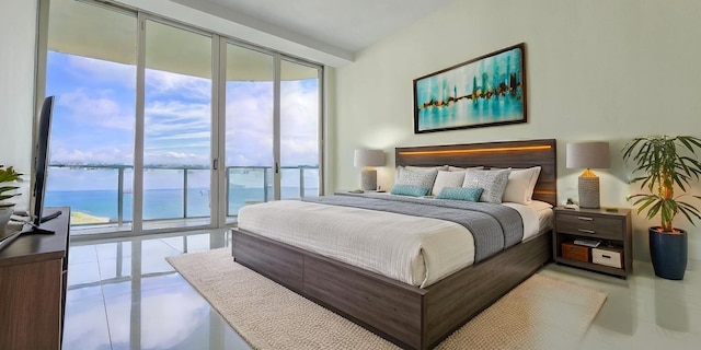 bedroom featuring floor to ceiling windows and access to outside