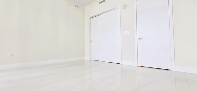 unfurnished bedroom featuring light tile patterned floors