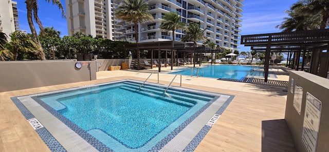 view of pool featuring a pergola and a patio area