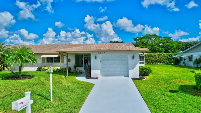 ranch-style home with a front yard and a garage